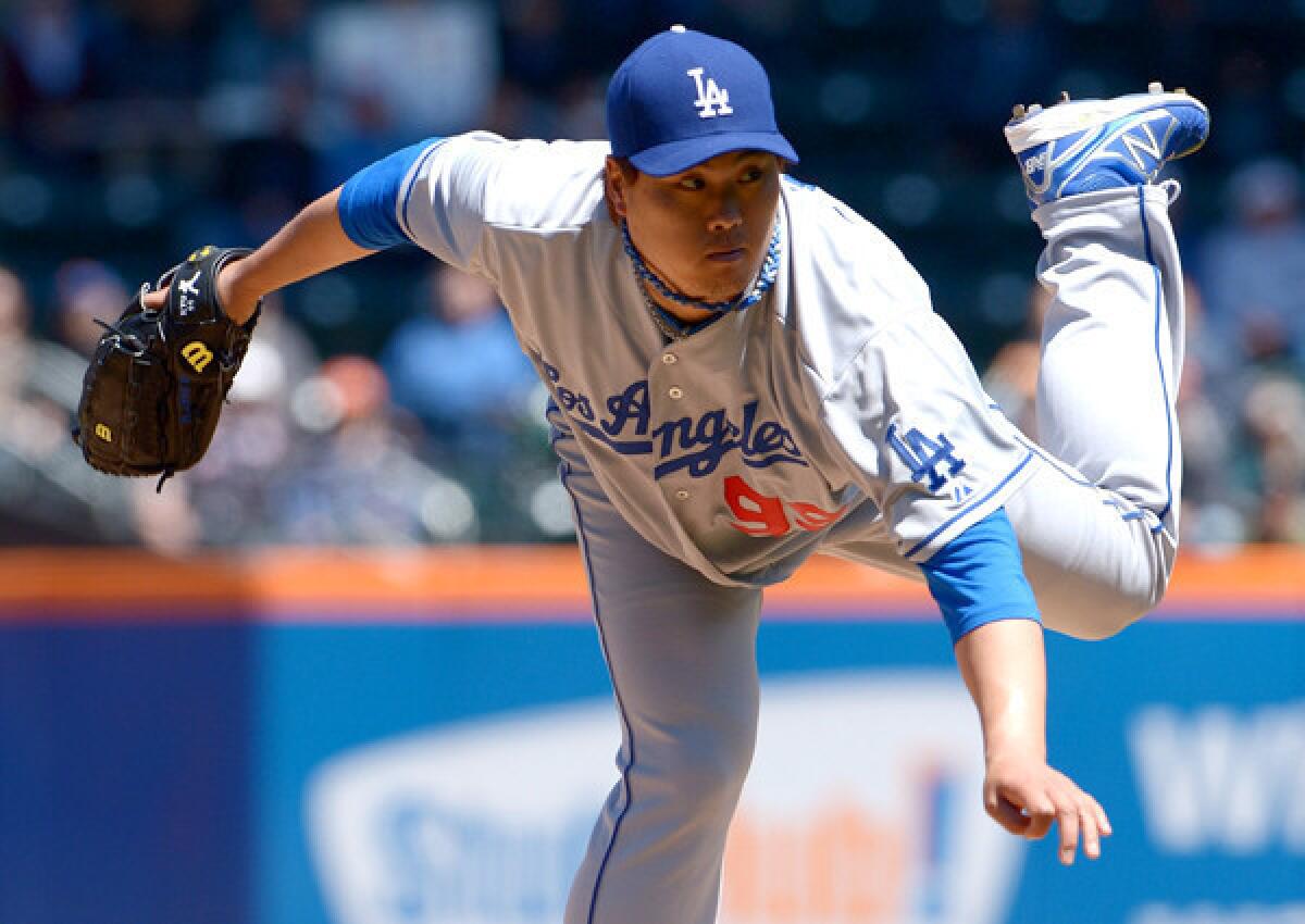 Dodgers starting pitcher Hyun-Jin Ryu follows through on a pitch against the Mets on Thursday afternoon at Citi Field in New York.