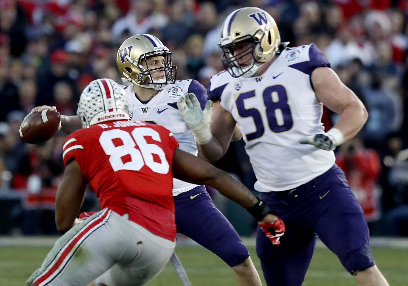Washington quarterback Jake Browning gets pressured by Ohio State defensive tackle Dre'Mont Jones in the third quarter of the Rose Bowl on Jan. 1.