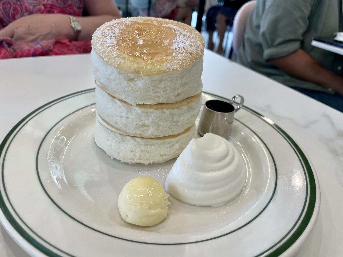 A stack of thick souffle pancakes.