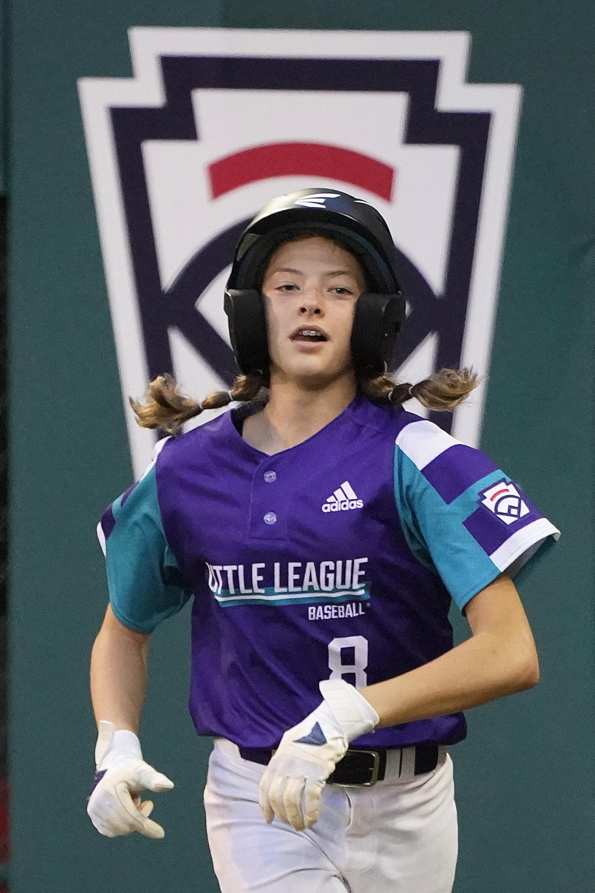 Abilene, Texas' Ella Bruning runs back to the dugout after scoring on a wild pitch