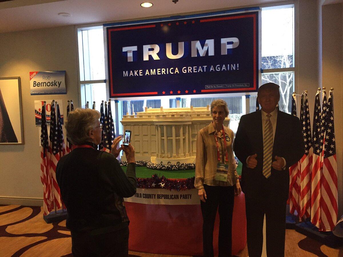 Nancy Neff of Palo Alto poses with a cardboard replica of President Trump at the California Republican Party's organizing convention, which kicks off Friday in Sacramento.