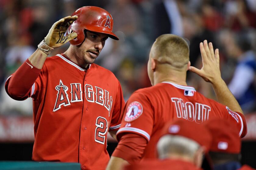 Angels left fielder Matt Joyce celebrates with Mike Trout after hitting a home run against the San Diego Padres on May 27.