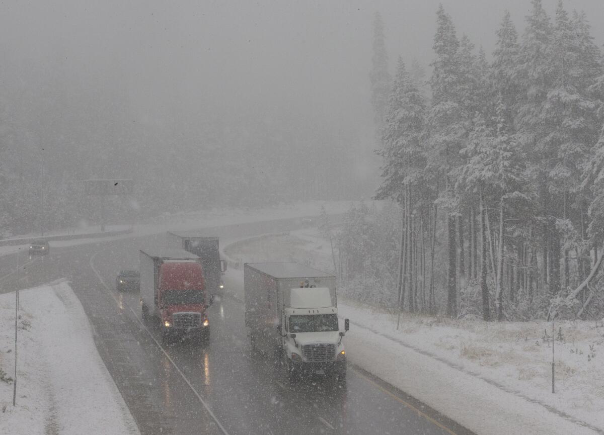 Vehicles drive through fog and light snow Oct. 17 on westbound Interstate 80 near Soda Springs.
