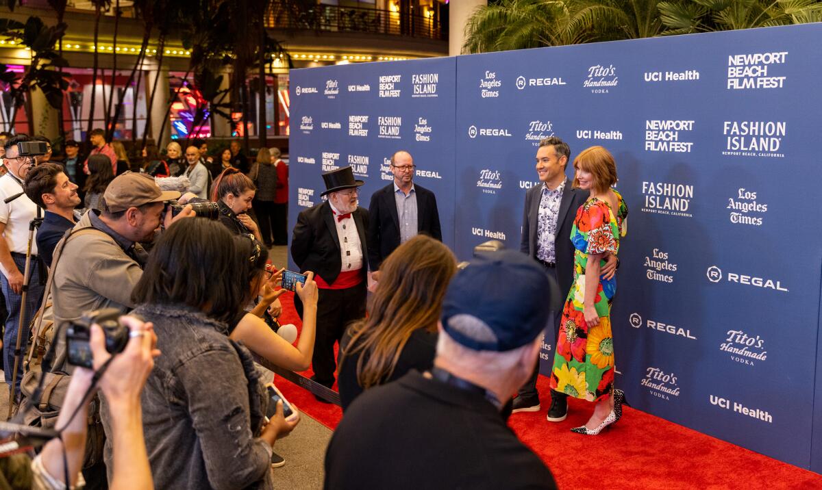Director Eric Appel and wife Johanna Parker Appel walk the red carpet.