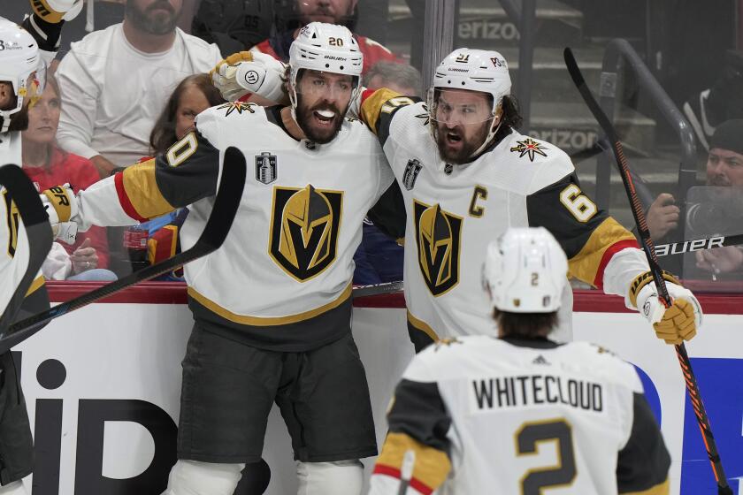 Vegas Golden Knights center Chandler Stephenson (20) is congratulated by his teammates.