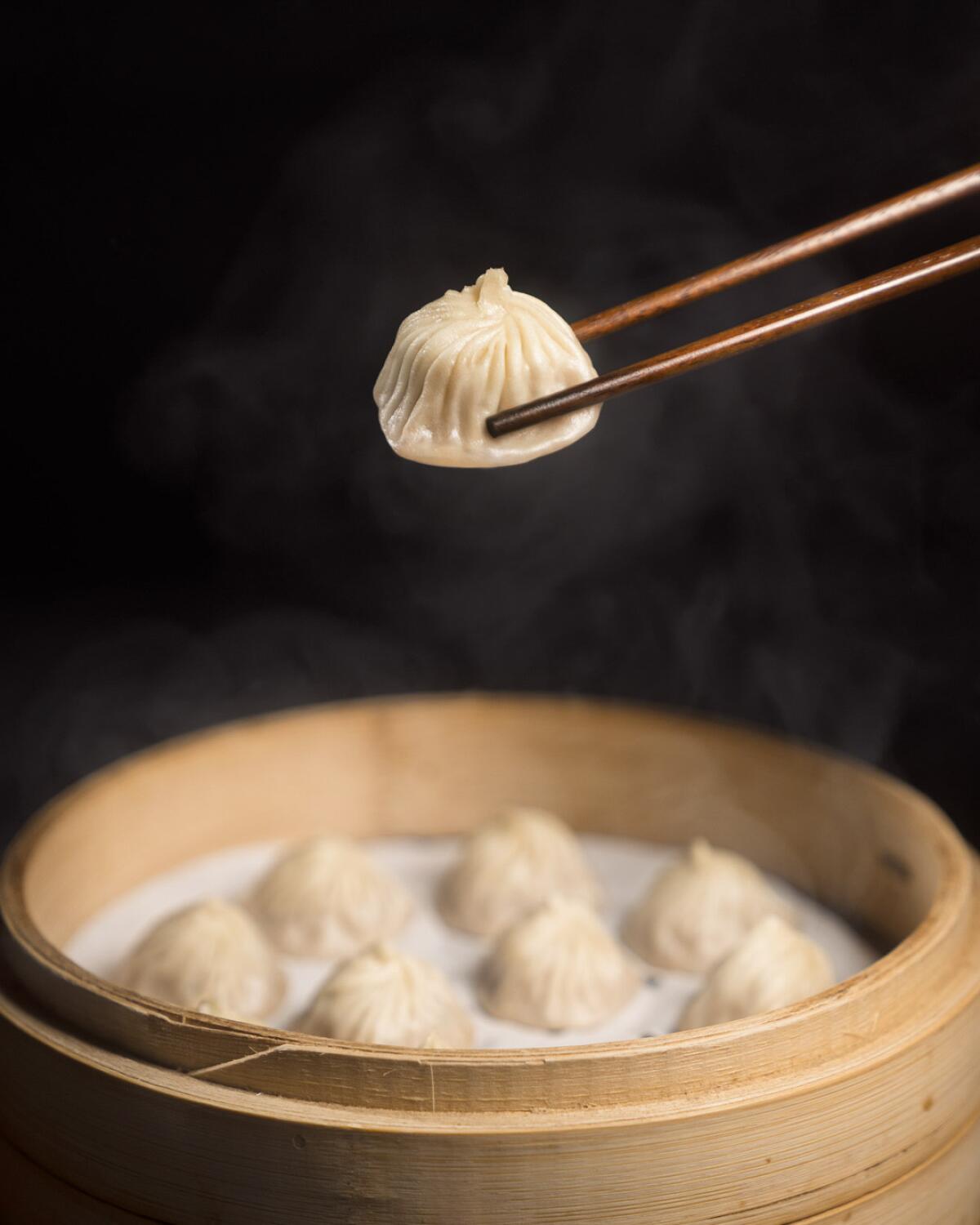 Xiao long bao at Chinese restaurant Din Tai Fung are broth-filled dumplings steamed in bamboo baskets.