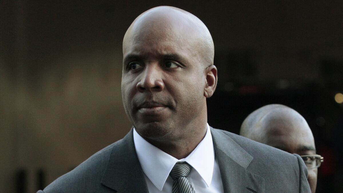 Barry Bonds arrives at federal court in San Francisco for his trial in March 2011. Last month, Bonds' obstruction of justice conviction was overturned by a federal appeals court.