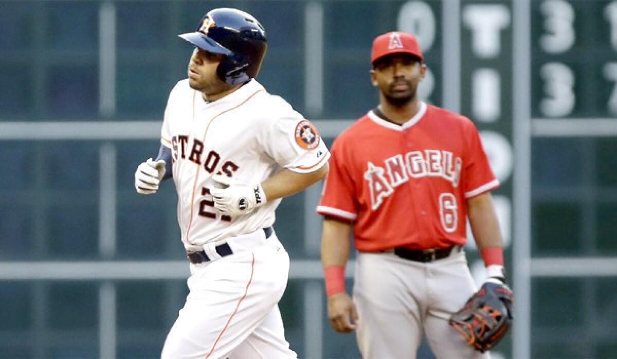 Jose Altuve rounds the bases after hitting a home run in his first at-bat against the Angels in the Astros' 7-6 victory Tuesday.