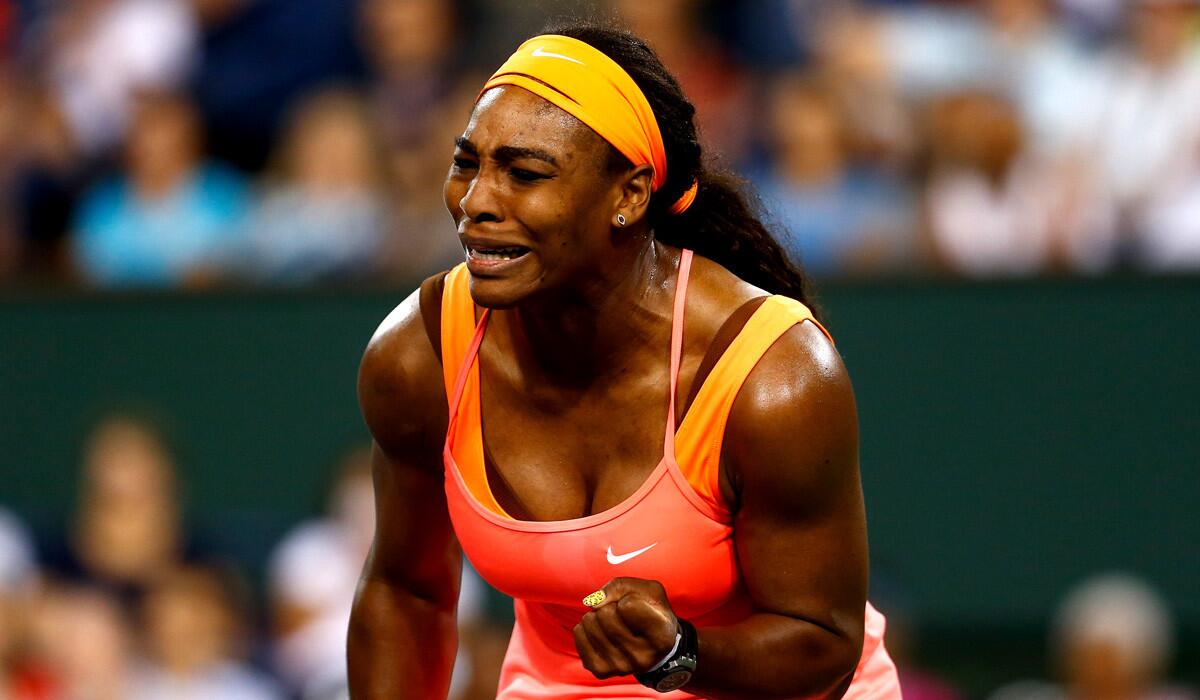 Serena Williams celebrates winning a game against Monica Niculescu during their match at the Paribas Open at the Indian Wells Tennis Garden on Friday.