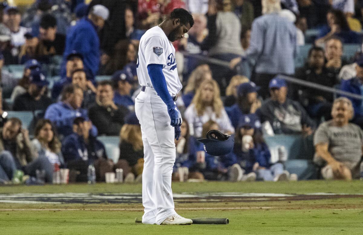 Dodgers right fielder Yasiel Puig drops his bat and helmet in the infield after flying out to end the fourth inning.