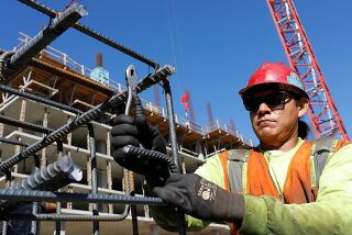 Lorenzo Robbins and other Local 229 ironworkers build a rebar column near what will become a Garden Communities residential high-rise on La Jolla Village Drive.