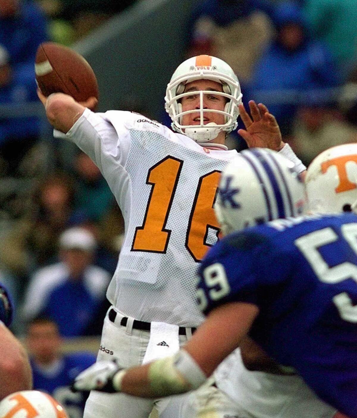 Tennessee quarterback Peyton Manning launches a pass during a game against Kentucky on Nov. 22, 1997.