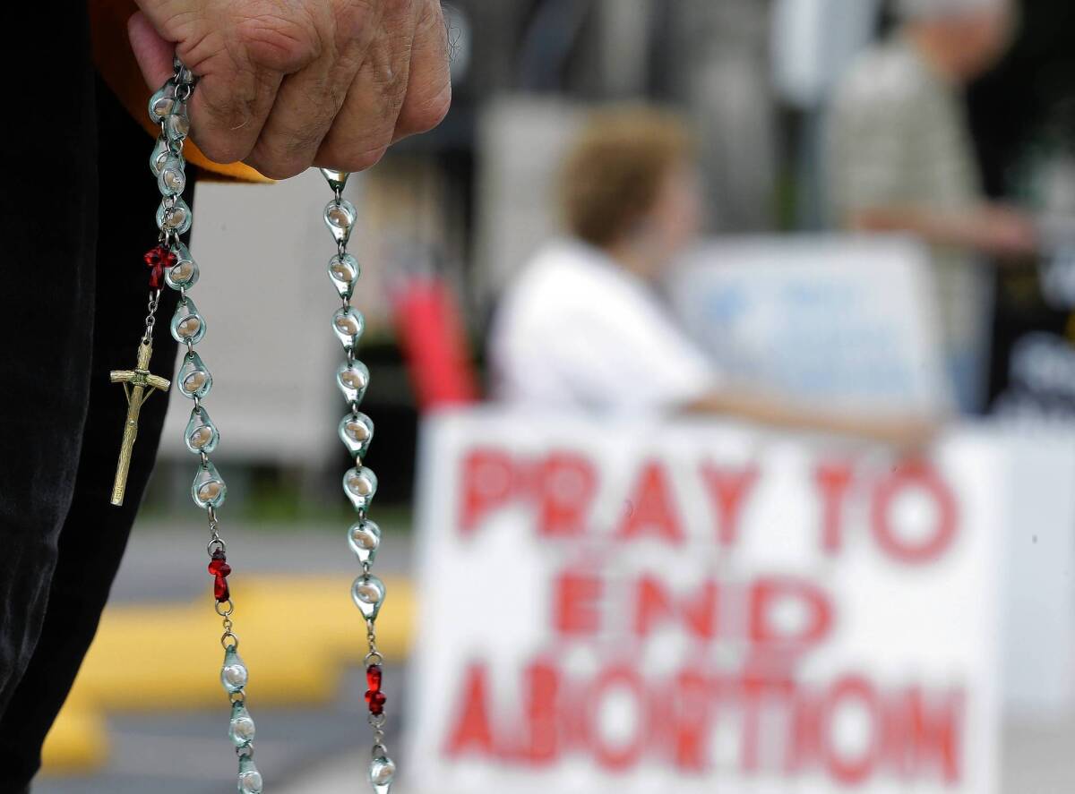 An antiabortion protester outside a Planned Parenthood clinic in San Antonio. In the last three years, legislatures in Texas, Ohio and several other states have adopted laws to restrict abortion.