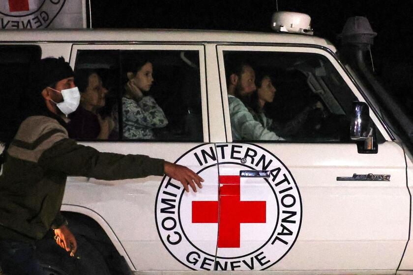 An International Red Cross vehicle carrying hostages released by Hamas drives towards the Rafah border point with Egypt ahead of their transfer to Israel on November 25, 2023. A group of 13 Israeli and four Thai hostages released by Hamas crossed into Egypt late Saturday, Egyptian state-linked television reported. (Photo by SAID KHATIB / AFP) (Photo by SAID KHATIB/AFP via Getty Images)