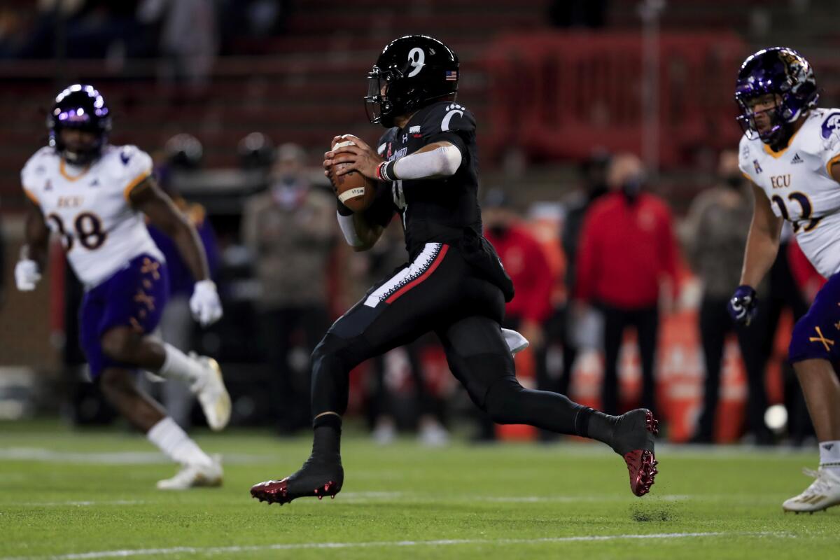 Cincinnati quarterback Desmond Ridder carries the ball against East Carolina on Nov. 13, 2020.