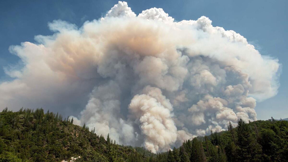 A large pyrocumulus cloud forms over the Carr fire near Redding, Calif., on July 27.