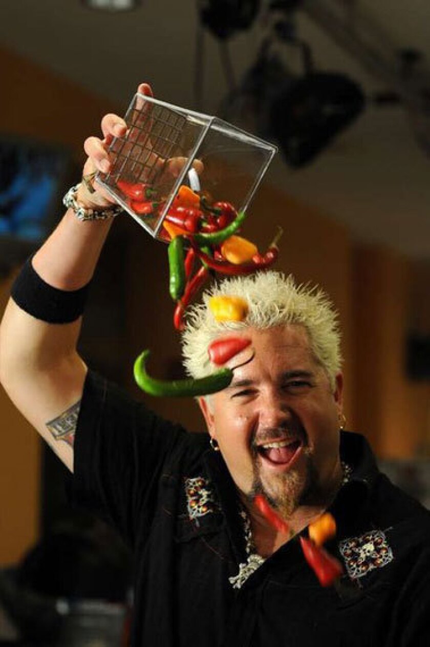 Guy Fieri's new restaurant in Times Square got a harsh but funny review by the New York Times' Pete Wells.
