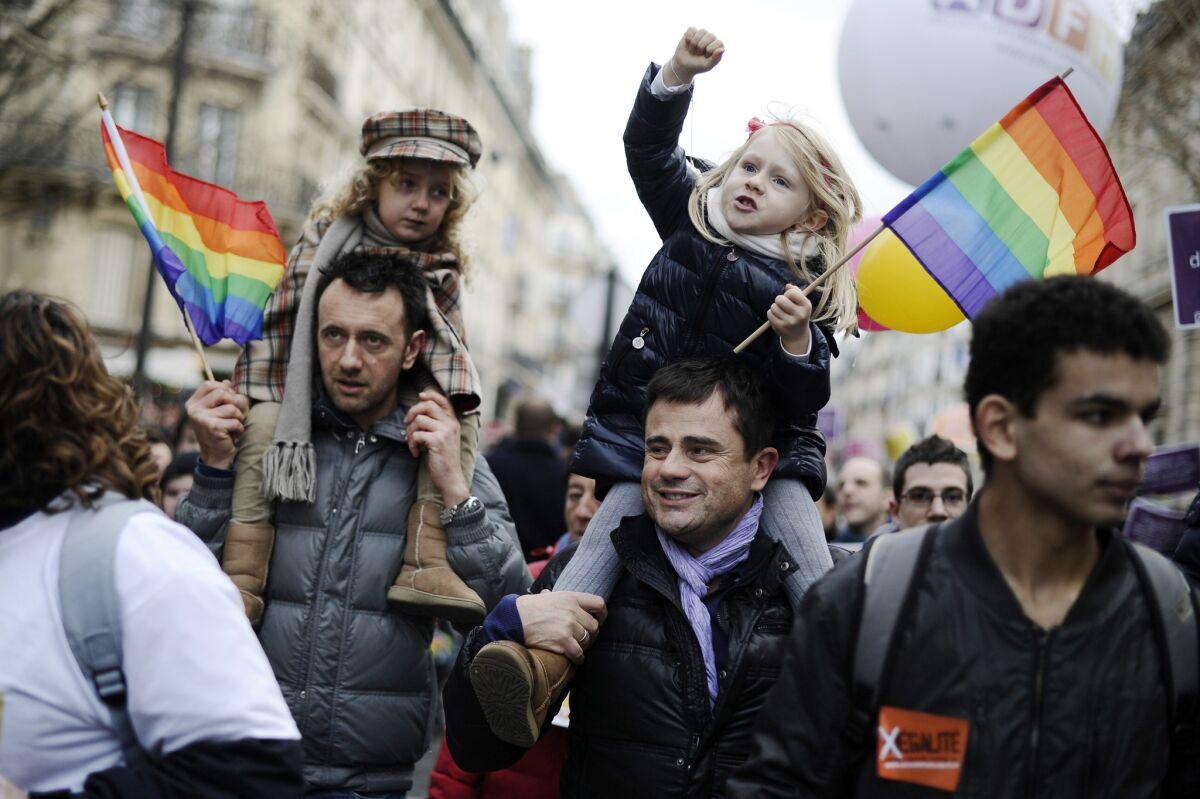 Fathers and daughters at a gay rights demonstration in Paris.