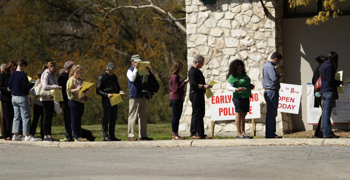 Voters wait to cast their ballots in San Antonio.