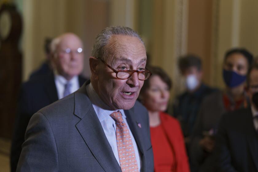 Senate Majority Leader Chuck Schumer, D-N.Y., talk about the need for the John Lewis Voting Rights Advancement Act, as he meets with reporters following a Democratic policy meeting at the Capitol in Washington, Tuesday, Nov. 2, 2021. (AP Photo/J. Scott Applewhite)