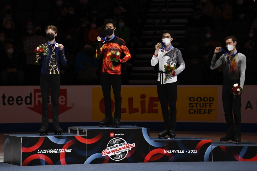 First place, Nathan Chen stands with second place, Ilia Malinin left, third place, Vincent Zhou and fourth place, Jason Brown, right, during the medal ceremony for the men's free skate program during the U.S. Figure Skating Championships Sunday, Jan. 9, 2022, in Nashville, Tenn. (AP Photo/Mark Zaleski)