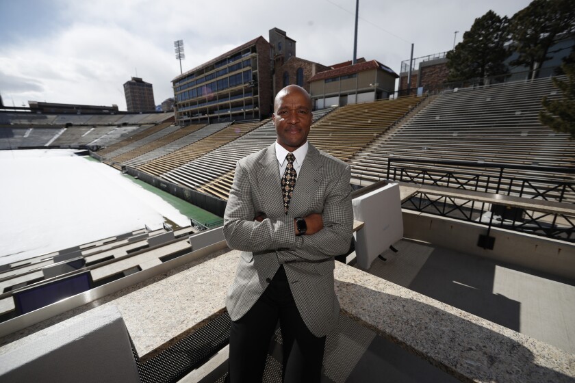 Colorado coach Karl Dorrell poses at Folsom Field.