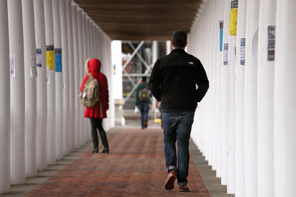 Students walk through an outdoor corridor on the University of Virginia campus in Charlottesville on December 6, 2014.