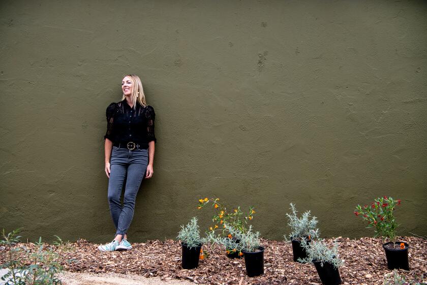LOS ANGELES , CA - MAY 18: Portrait of Sarah Lariviere in her backyard in Burbank on Wednesday, May 18, 2022 in Los Angeles , CA. Lariviere and her husband removed their front and back lawns, replacing them with drought friendly, low water plants and desert gardens. (Mariah Tauger / Los Angeles Times)
