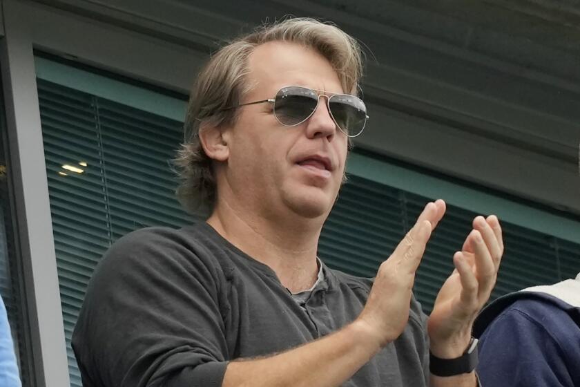 FILE - American businessman Todd Boehly applauds during the English Premier League soccer match between Chelsea and Wolverhampton at Stamford Bridge stadium, in London, Saturday, May 7, 2022. The Premier League has approved the proposed sale of Chelsea to a consortium fronted by Los Angeles Dodgers part-owner Todd Boehly, although the U.K. government still needs to sign off on the deal before it can be completed. (AP Photo/Frank Augstein, File)