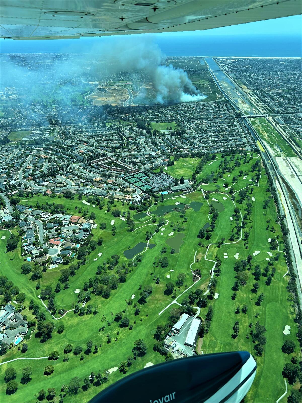 A fire at Fairview Park in Costa Mesa burned 8.4 acres of brush Sunday.