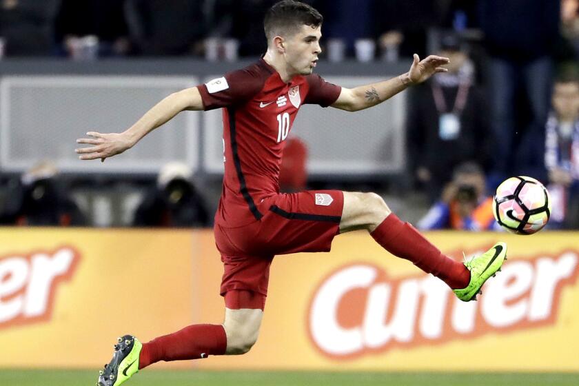 United States' Christian Pulisic, right, stops a pass next to a Honduras defender during the first half of a World Cup qualifying soccer match Friday, March 24, 2017, in San Jose, Calif. (AP Photo/Marcio Jose Sanchez)