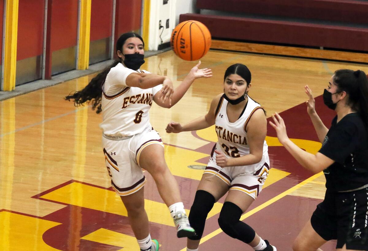 Estancia High School's Mackenzie Sanchez (0) saves the ball from going out of bounds in the Battle for the Bell.