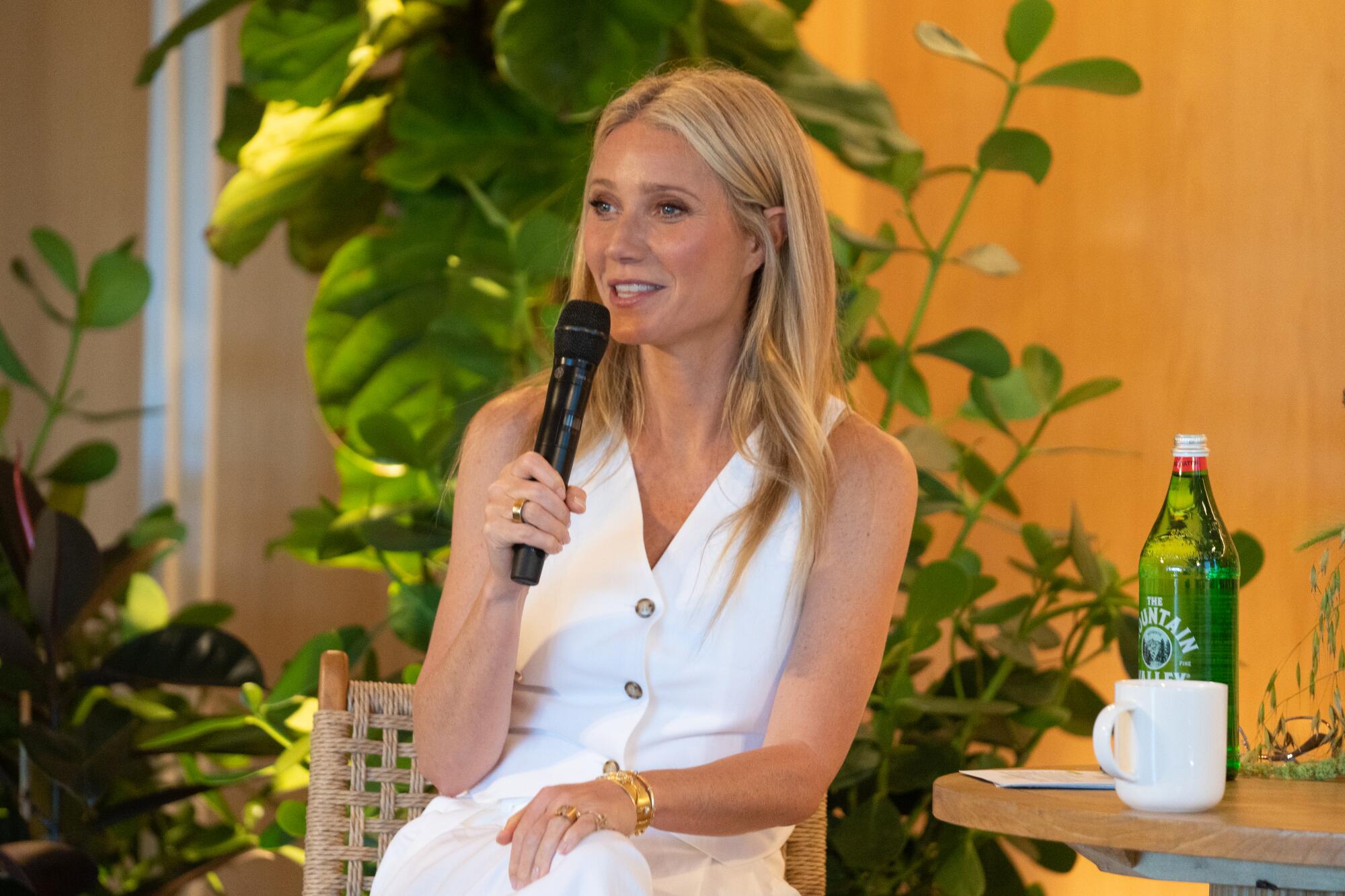 Gwyneth Paltrow speaks before a crowd at the Goop Immersive event in Santa Monica.