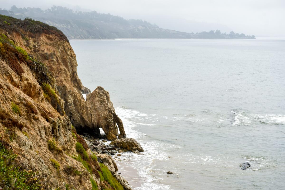 A view of a cliff and the Pacific ocean.