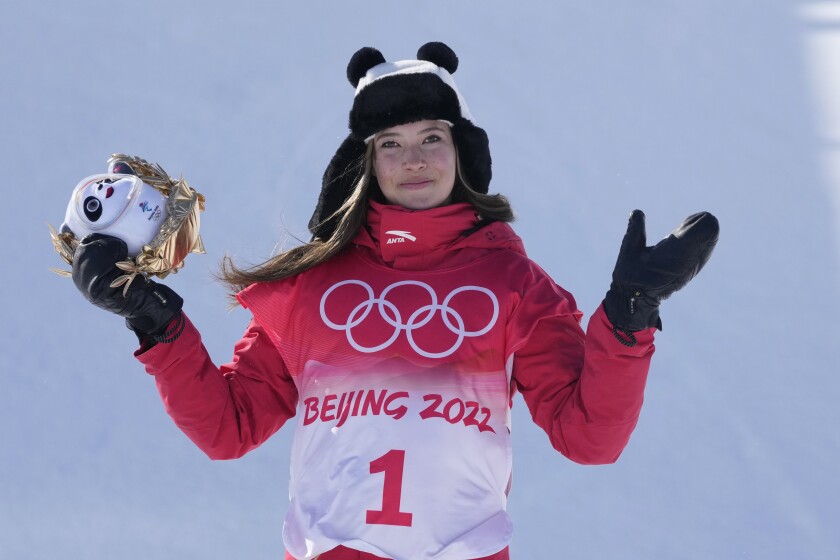 Eileen Gu holds a stuffed panda