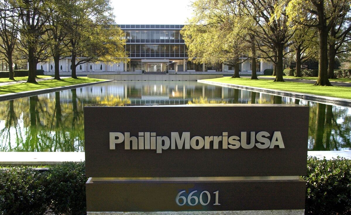 FILE - In this November 2003 file photo is the reflecting pool in front of the Philip Morris USA headquarters in Richmond, Va. Philip Morris said Wednesday, May 11, 2022, it’s expanding further in the smoke-free segment of the tobacco market with an offer to buy Swedish Match for about $16 billion in cash. Swedish Match, based in Stockholm, makes nicotine pouches, chewing tobacco and moist snuff, among other items. It derives more than 65% of its sales from smoke-free products, with most sales in the U.S. and Scandinavia. Philip Morris, which said it derived all of its revenue in 2015 from cigarettes, aims to be predominantly smoke-free by 2025. (P. Kevin Morley/Richmond Times-Dispatch via AP)