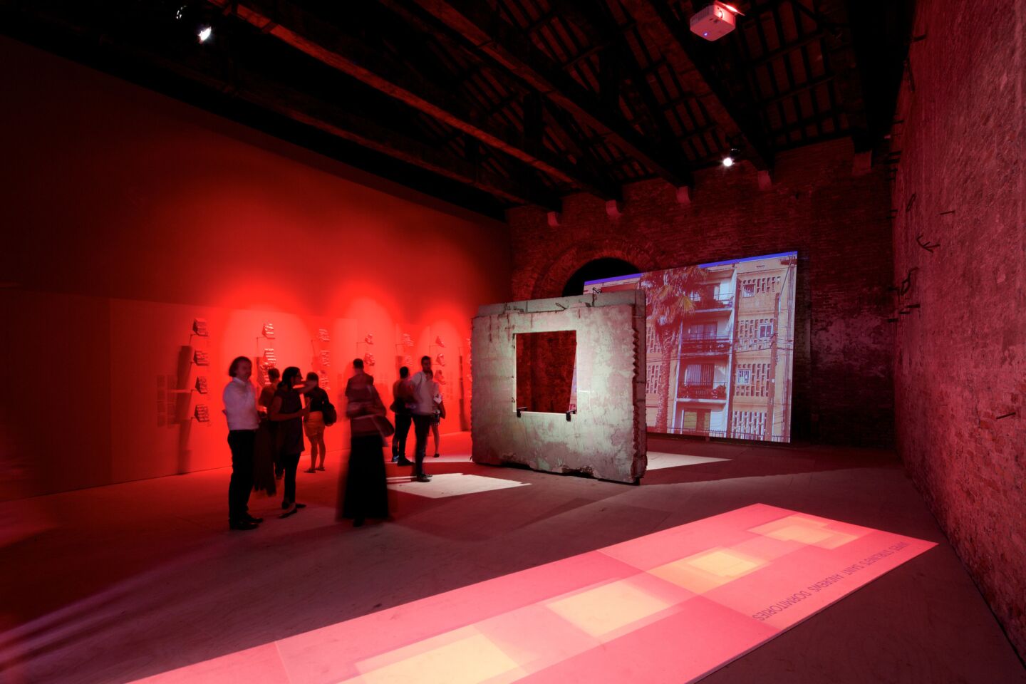 An installation view of Pedro Alonso and Hugo Palmarola's project, 'Monolith Controversies,' at the Venice Architecture Biennale in 2014. In the early '70s, the Soviet Union donated a pre-fab panel factory to Chile. Alonso and Palmarola located one of the first panels ever made and put it on display. It was signed by Chilean president Salvador Allende.