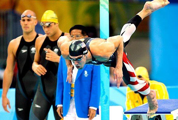 Michael Phelps begins the first leg of the 400-meter freestyle relay.