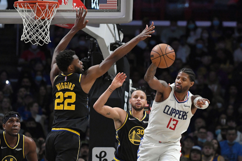 LOS ANGELES, CA - NOVEMBER 28: Paul George #13 of the Los Angeles Clippers passes under pressure.