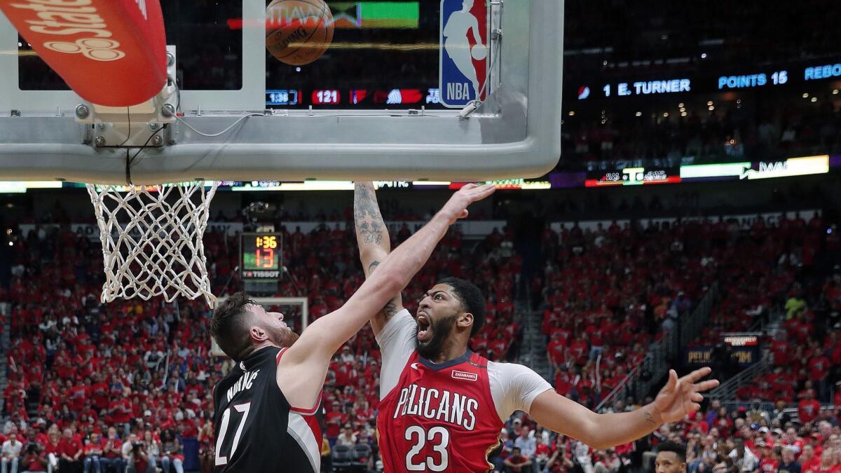 New Orleans Pelicans forward Anthony Davis (23) shoots against Portland Trail Blazers center Jusuf Nurkic (27) during the second half.