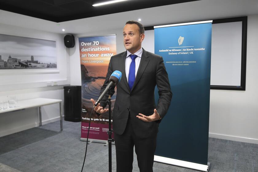 Ireland's Taoiseach Leo Varadkar speaks to the media following private talks with Britain's Prime Minister Boris Johnson, at Liverpool Airport, England, Thursday, Oct. 10, 2019. The leaders of Britain and Ireland said they spotted a "pathway" to an elusive Brexit deal as hopes for a breakthrough dimmed before the U.K.'s Oct. 31 deadline to leave the European Union. The two said in a joint statement they "agreed that they could see a pathway to a possible deal." (Peter Byrne/PA via AP)