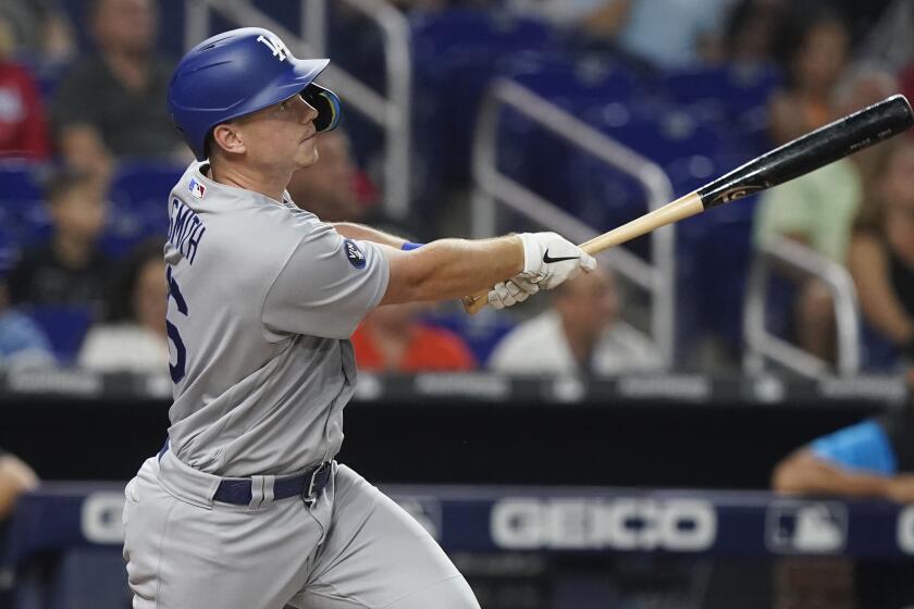 Los Angeles Dodgers' Will Smith (16) hits a home run.