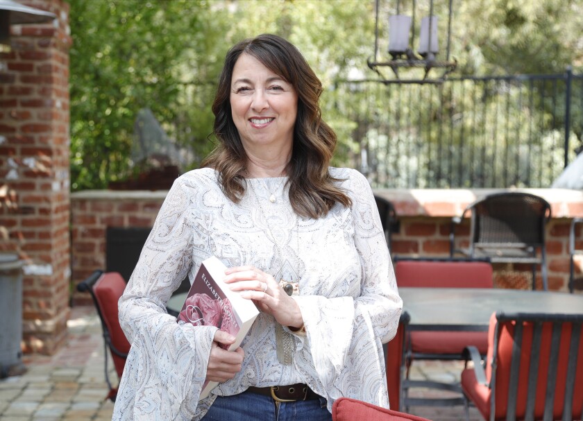 Elizabeth Conte with her debut book, "Finding Jane."