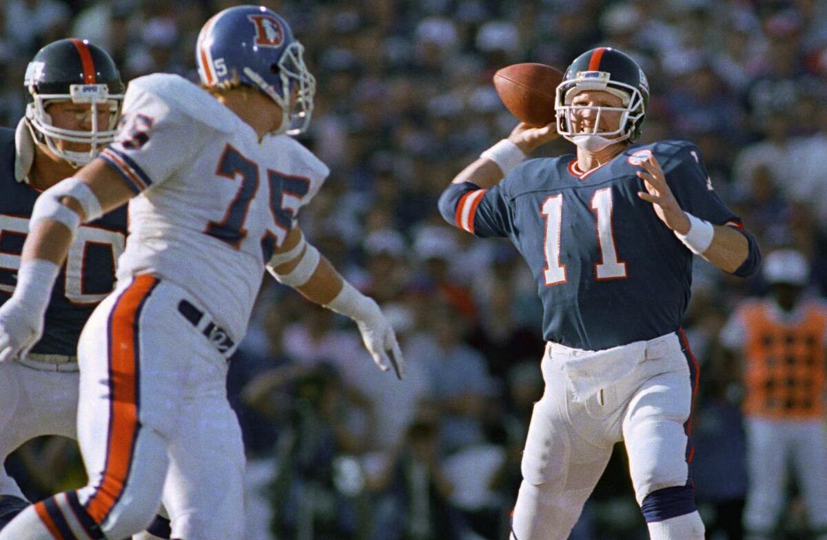 New York Giants quarterback Phil Simms passes against the Denver Broncos in Super Bowl XXI.