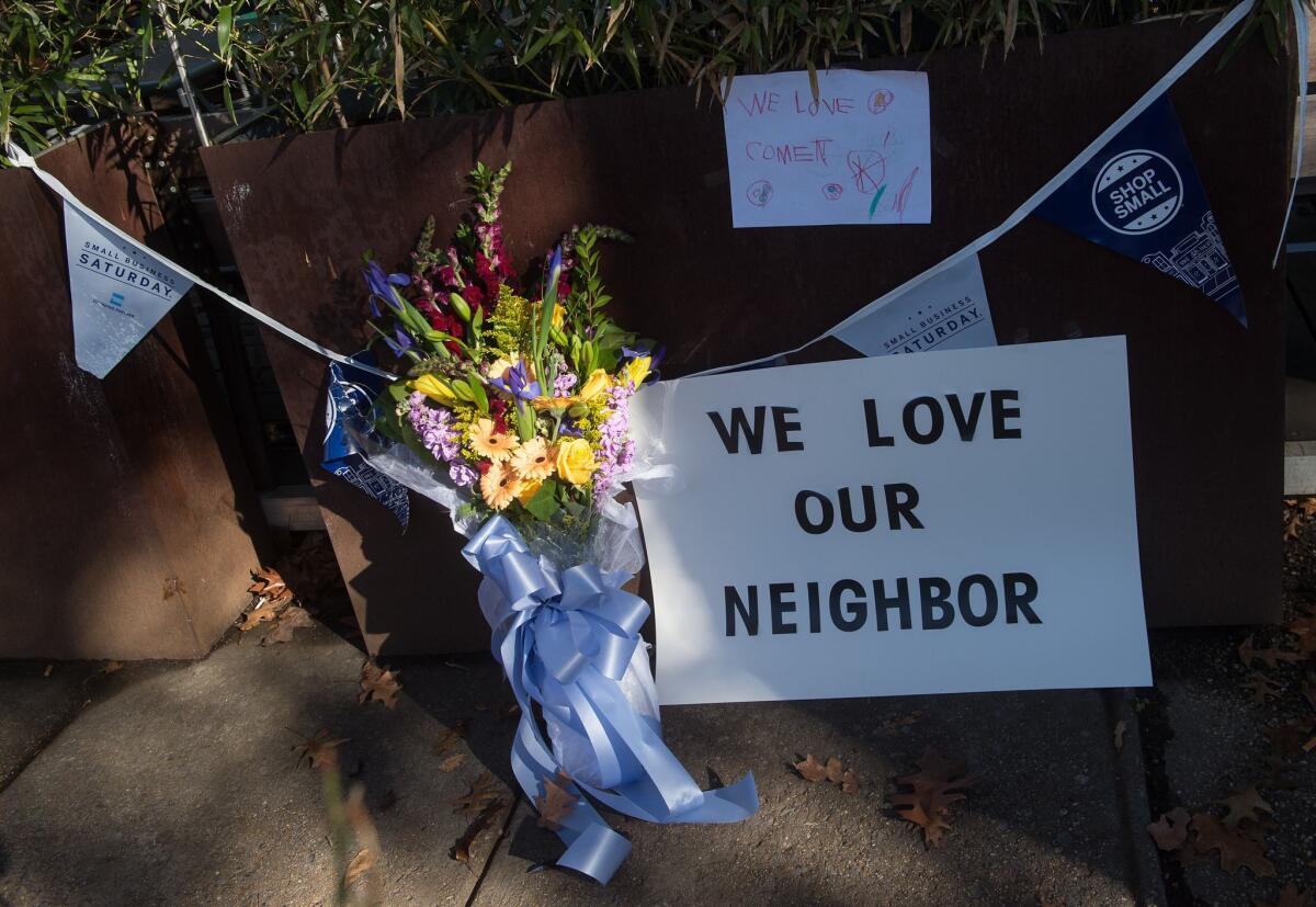 Flowers and signs adorn the front of a Washington restaurant targeted Sunday by a gunman who told police he was responding to unfounded rumors about a child sex ring.