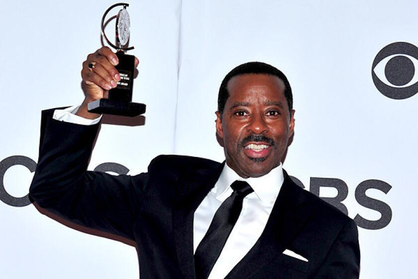 Courtney B. Vance poses with his award for best featured actor in a play for "Lucky Guy" in the press room.