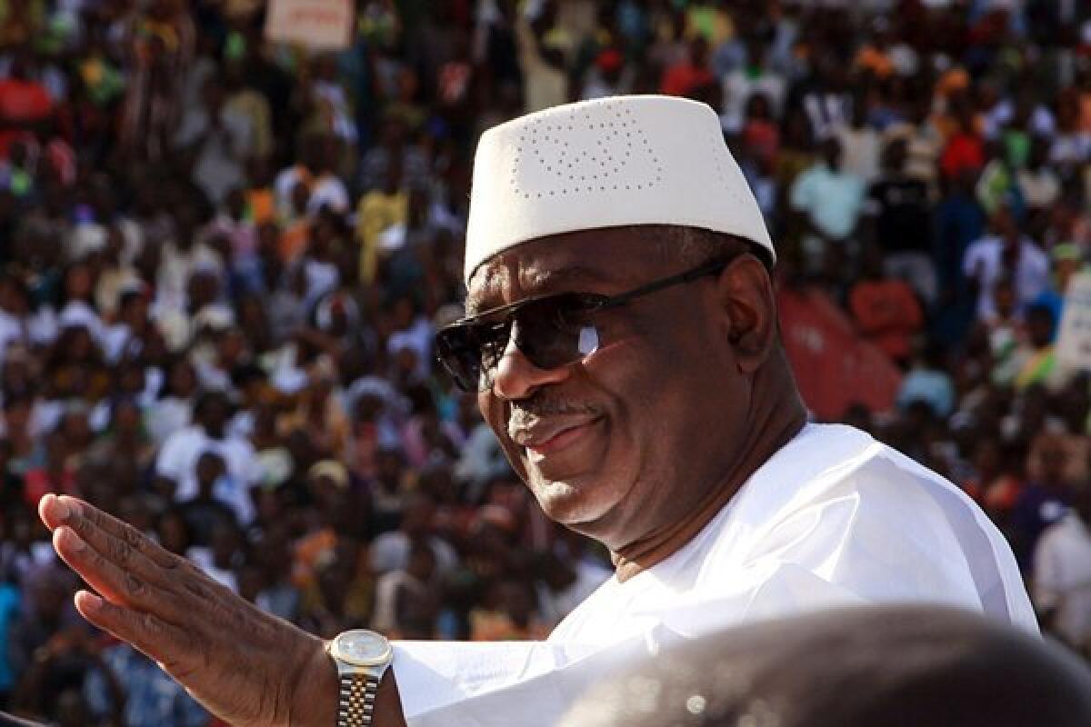Mali's former prime minister, Ibrahim Boubacar Keita, waves to supporters at a stadium in Bamako Jan. 14, 2013. He will face former Finance Minister Soumaila Cisse in a presidential runoff Aug. 11.