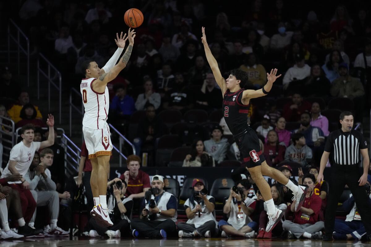 USC guard Kobe Johnson shoots over Stanford guard Andrej Stojakovic at Galen Center on Saturday.