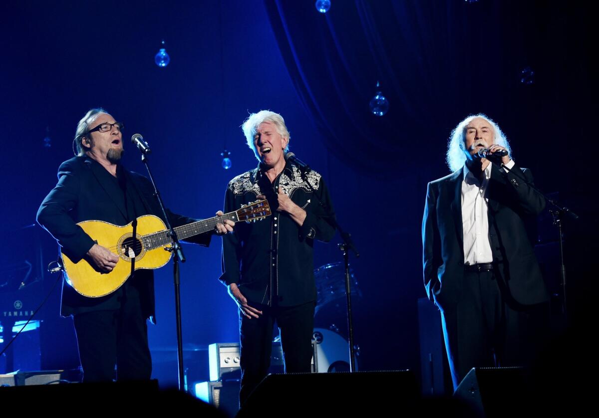 Musicians Stephen Stills, left, Graham Nash and David Crosby of Crosby, Stills & Nash perform at the Los Angeles Convention Center at a Feb. 6 gala honoring Bob Dylan.