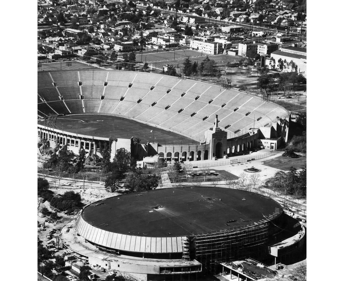 Early 1959: The Los Angeles Memorial Sports Arena is under construction, foreground, with the Memorial Coliseum in the background. This photo was published in the Feb. 22, 1959, Los Angeles Times.